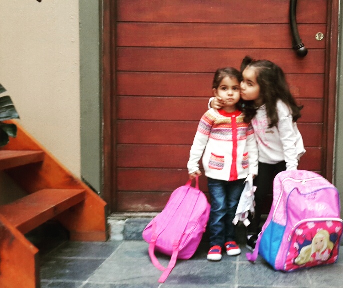 Big sister was superexcited for her sister to start school that she couldnt help but kiss and hug through all the photos.